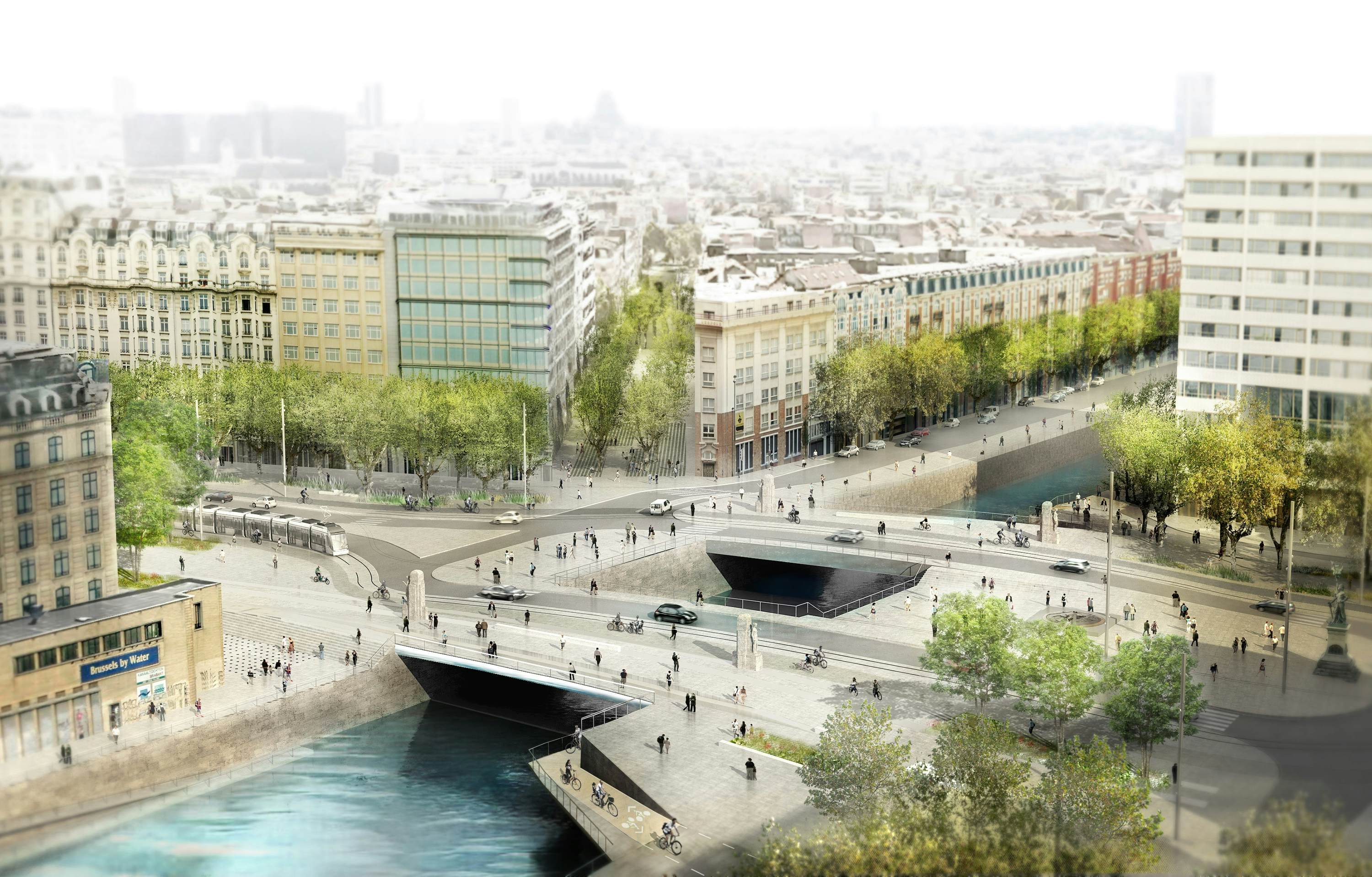 Luchtfoto van het toekomstige plein met twee bruggen over het kanaal met elk een rijstrook, tramrails en een breed trottoir.